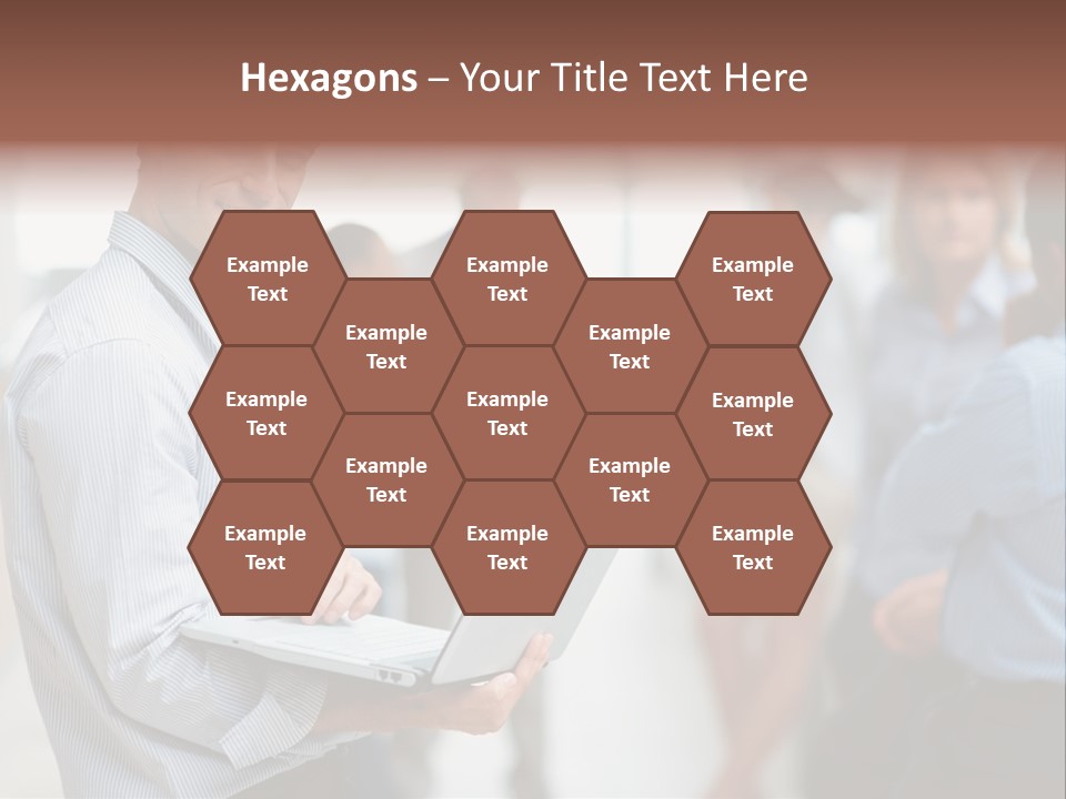 A Man Holding A Laptop In Front Of A Group Of People PowerPoint Template