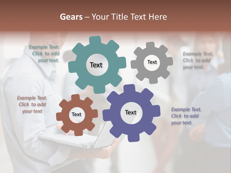 A Man Holding A Laptop In Front Of A Group Of People PowerPoint Template