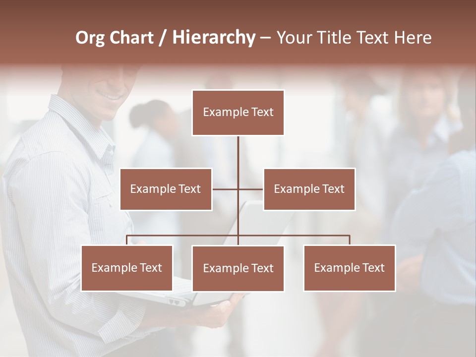 A Man Holding A Laptop In Front Of A Group Of People PowerPoint Template
