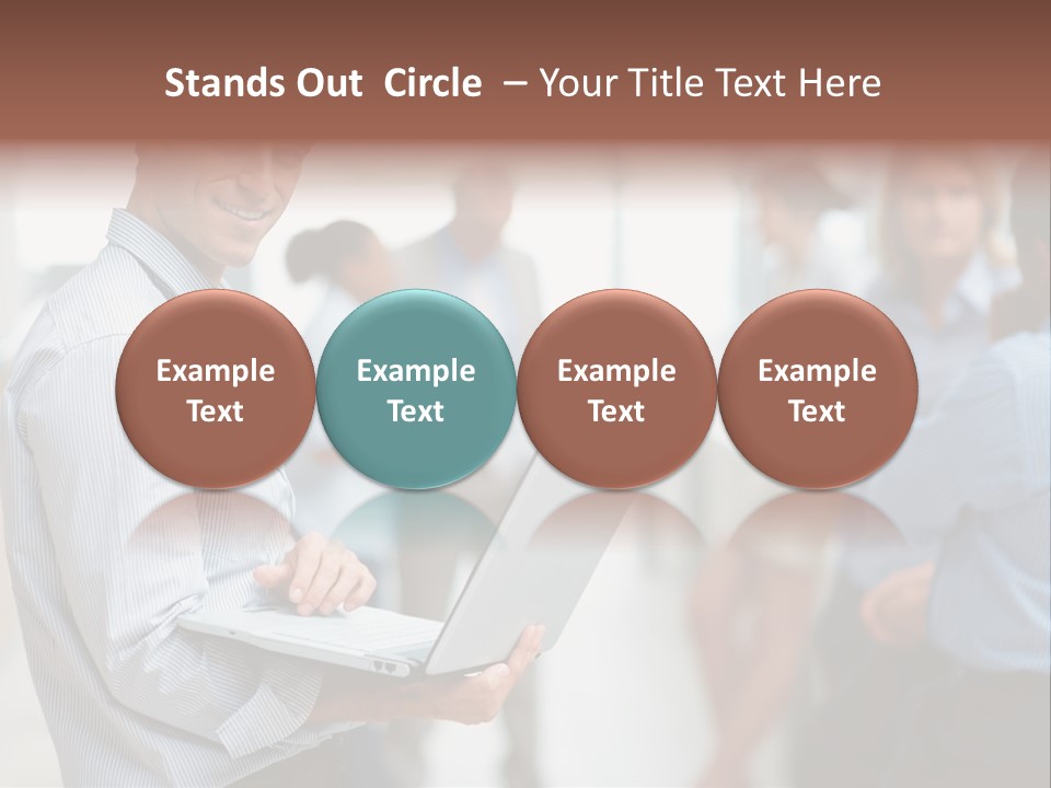 A Man Holding A Laptop In Front Of A Group Of People PowerPoint Template