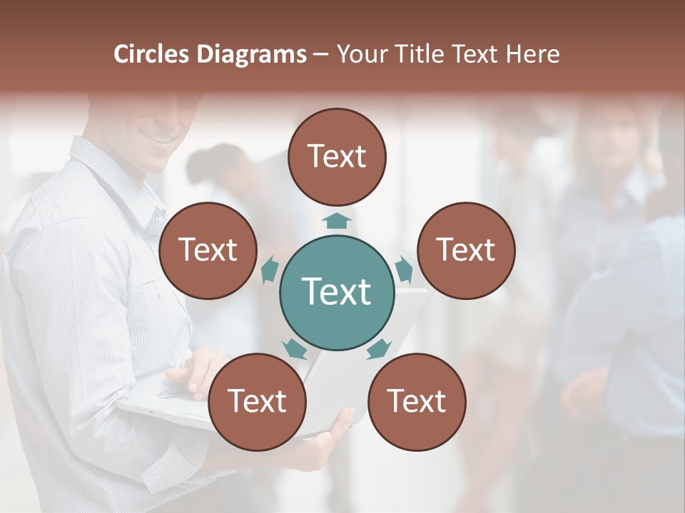 A Man Holding A Laptop In Front Of A Group Of People PowerPoint Template