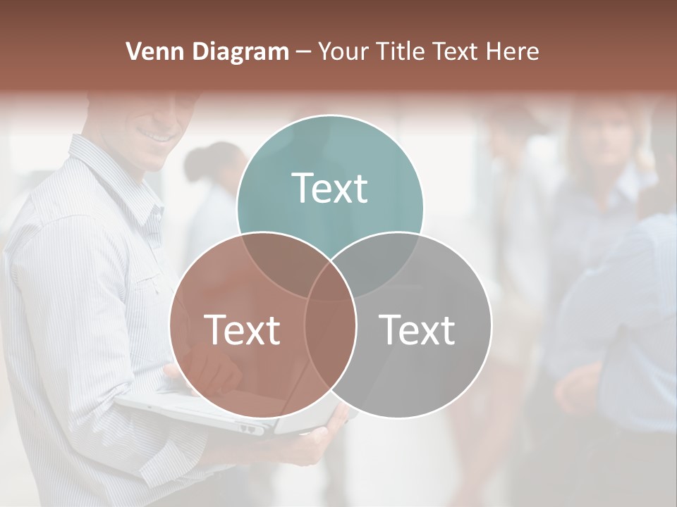 A Man Holding A Laptop In Front Of A Group Of People PowerPoint Template