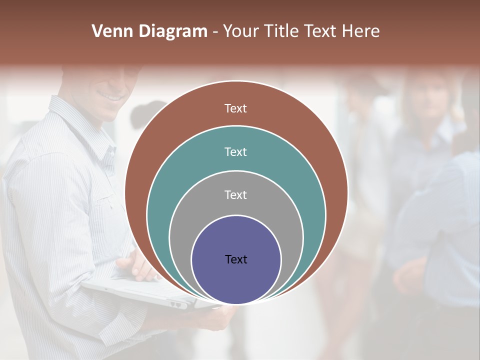 A Man Holding A Laptop In Front Of A Group Of People PowerPoint Template