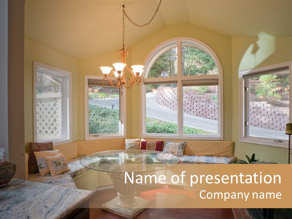 A Table With A Glass Top In Front Of A Window PowerPoint Template