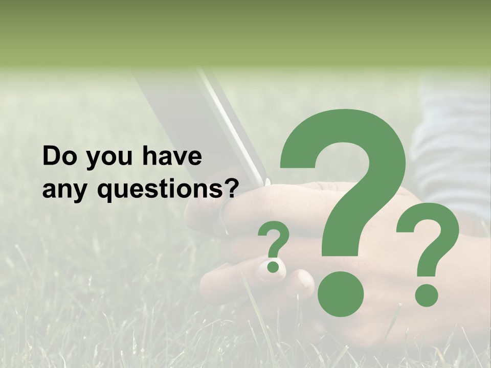 A Person Using A Cell Phone In The Grass PowerPoint Template
