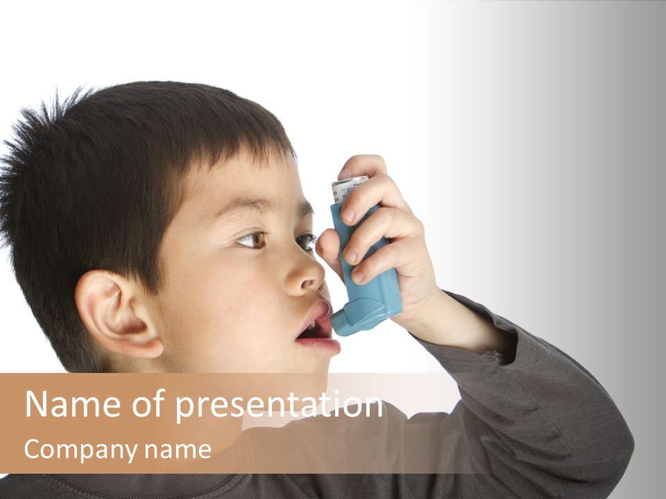 A Young Boy Holding A Cell Phone To His Ear PowerPoint Template