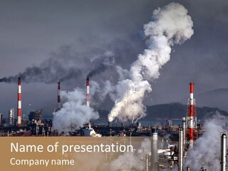 A Power Plant With Smoke Coming Out Of It PowerPoint Template