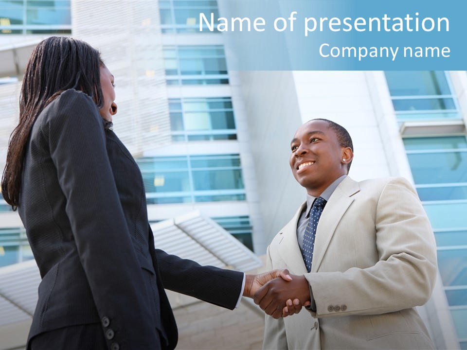 Two Business People Shaking Hands In Front Of A Building PowerPoint Template