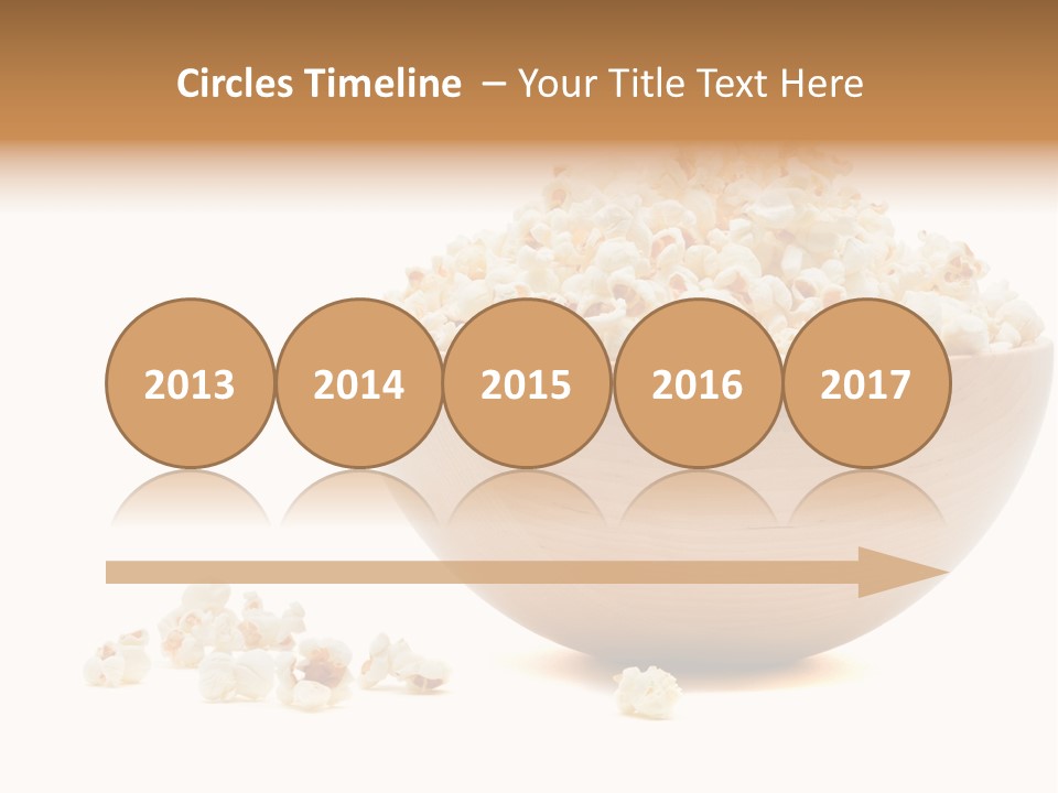 A Wooden Bowl Filled With Popcorn On Top Of A Table PowerPoint Template