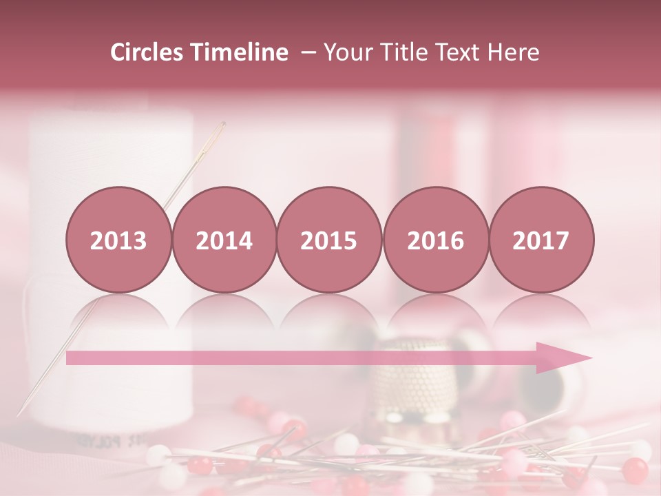 A Group Of Sewing Needles Sitting Next To A Roll Of Thread PowerPoint Template