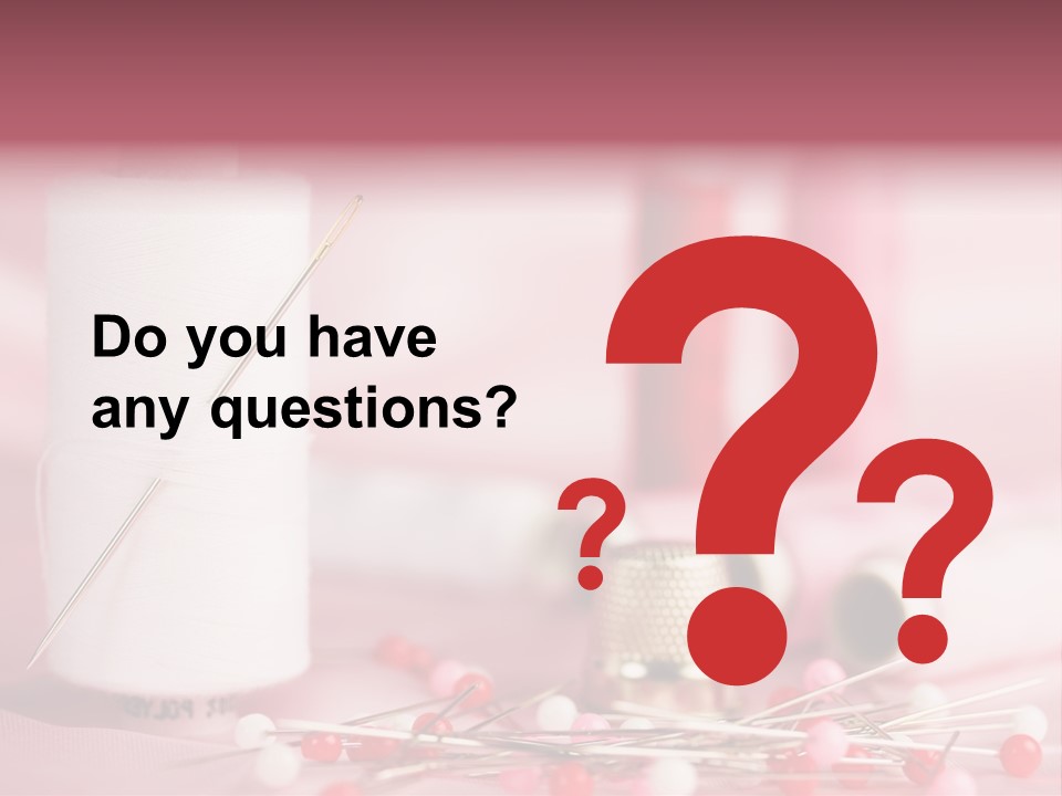 A Group Of Sewing Needles Sitting Next To A Roll Of Thread PowerPoint Template