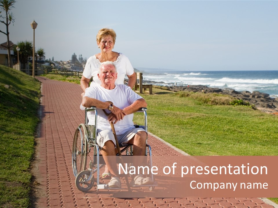 A Man In A Wheel Chair Being Pushed By A Woman PowerPoint Template