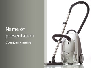A Silver And Black Vacuum Cleaner On A Table PowerPoint Template