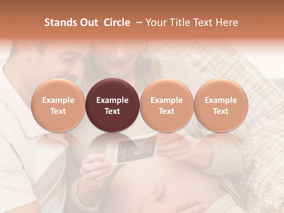 A Man And Woman Sitting On A Couch Looking At A Picture PowerPoint Template