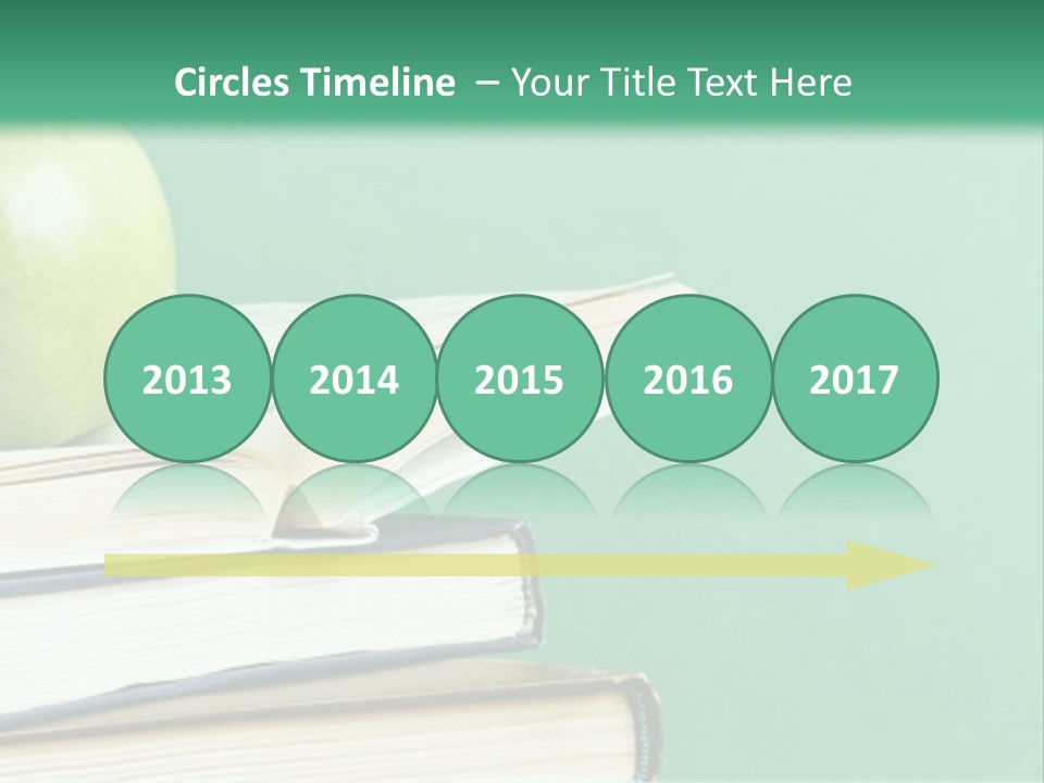 A Green Apple Sitting On Top Of A Stack Of Books PowerPoint Template