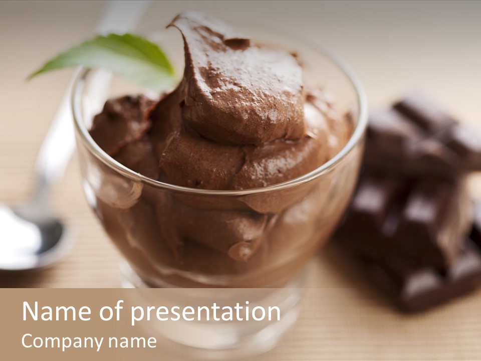 A Bowl Of Chocolate Ice Cream With A Spoon Next To It PowerPoint Template