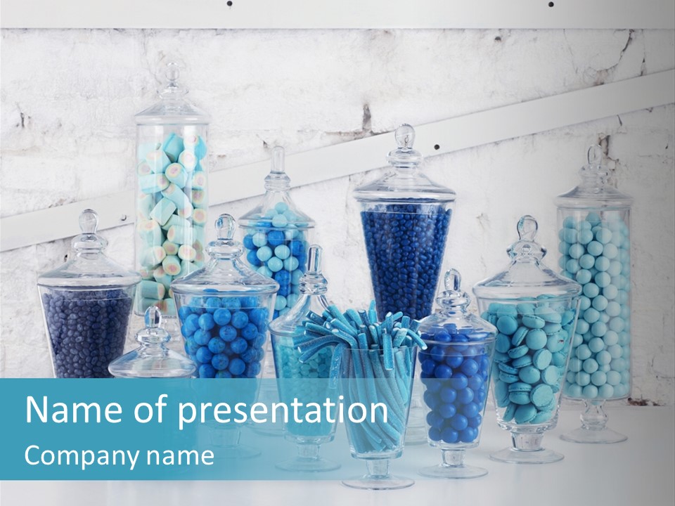A Table Topped With Lots Of Blue And White Candy PowerPoint Template
