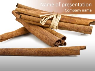 A Pile Of Cinnamon Sticks On A White Background PowerPoint Template