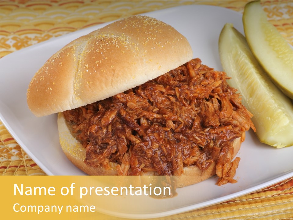 A Pulled Pork Sandwich With Pickles On A Plate PowerPoint Template