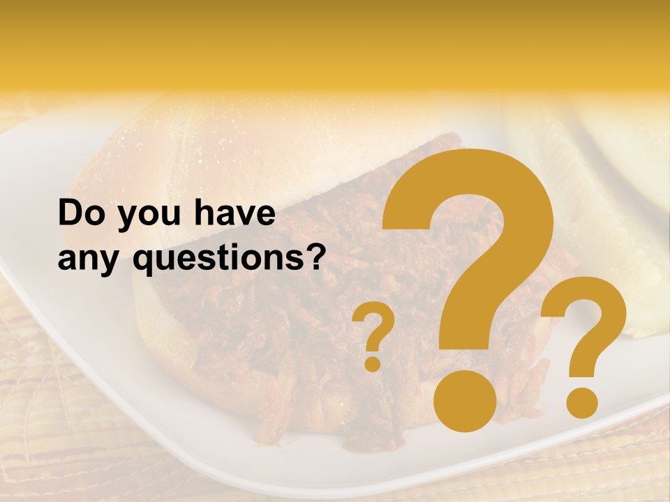 A Pulled Pork Sandwich With Pickles On A Plate PowerPoint Template