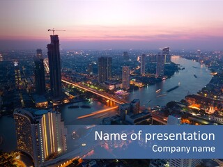 An Aerial View Of A City At Night PowerPoint Template