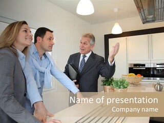 A Group Of People Standing Around A Kitchen Counter PowerPoint Template