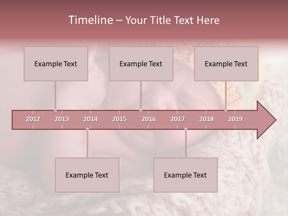 A Baby Wearing A Knitted Hat Laying On Top Of A Blanket PowerPoint Template