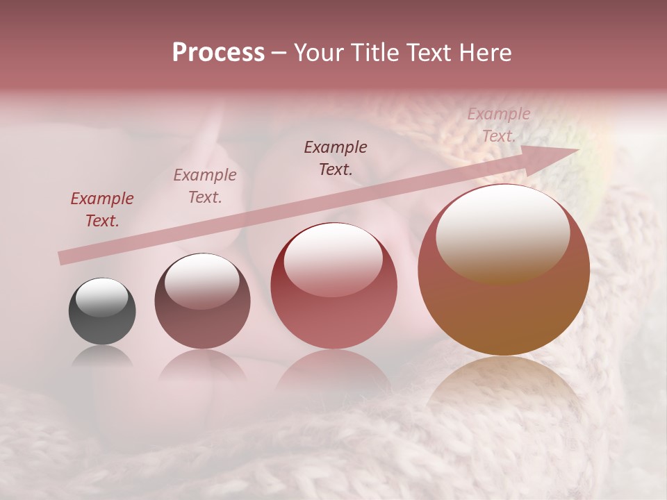 A Baby Wearing A Knitted Hat Laying On Top Of A Blanket PowerPoint Template