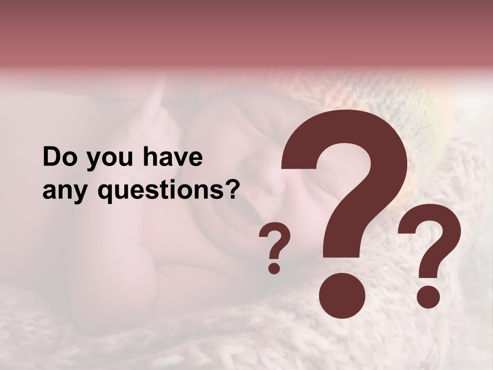 A Baby Wearing A Knitted Hat Laying On Top Of A Blanket PowerPoint Template