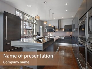 A Modern Kitchen With Stainless Steel Appliances And A Large Window PowerPoint Template