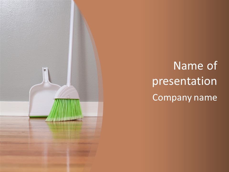 A Broom And A Dustpan On A Hard Wood Floor PowerPoint Template