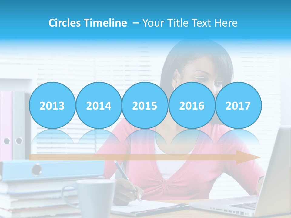 A Woman Sitting At A Desk With A Laptop PowerPoint Template