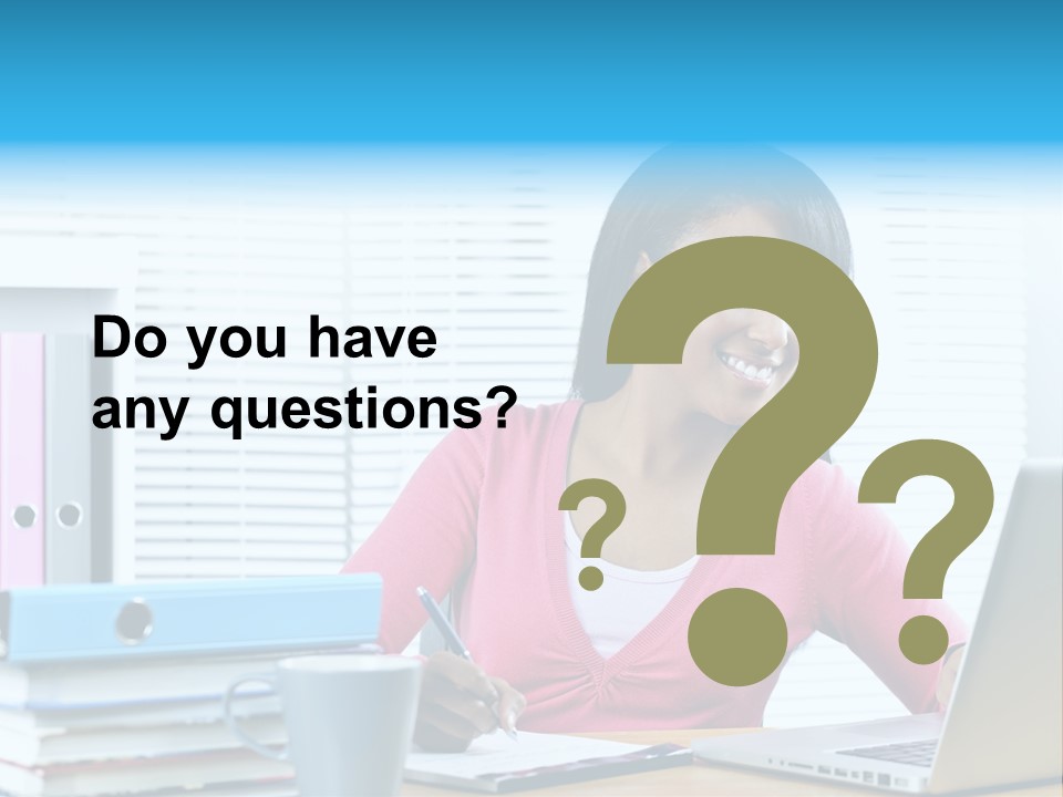 A Woman Sitting At A Desk With A Laptop PowerPoint Template