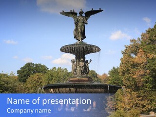 A Fountain With An Angel Statue On Top Of It PowerPoint Template