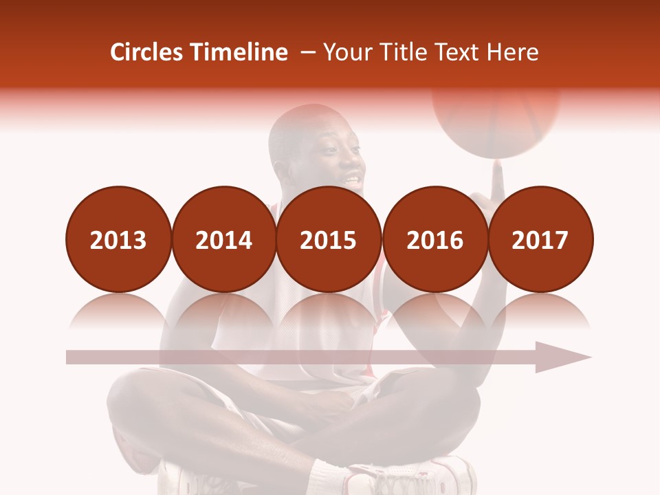 A Man Sitting On A Stool Holding A Basketball PowerPoint Template