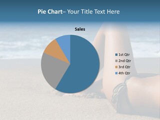 A Woman In A Bikini Laying On The Beach PowerPoint Template