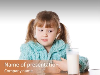 A Little Girl Sitting At A Table With A Glass Of Milk PowerPoint Template