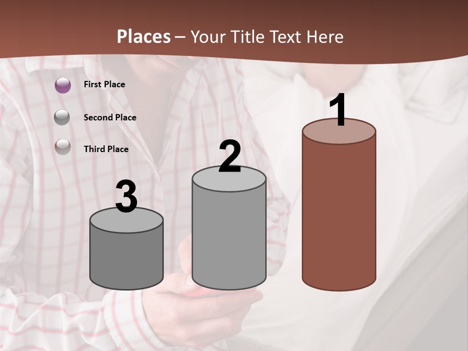 A Man Sitting On A Bed Looking At His Cell Phone PowerPoint Template