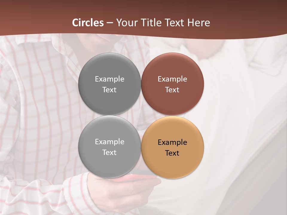 A Man Sitting On A Bed Looking At His Cell Phone PowerPoint Template