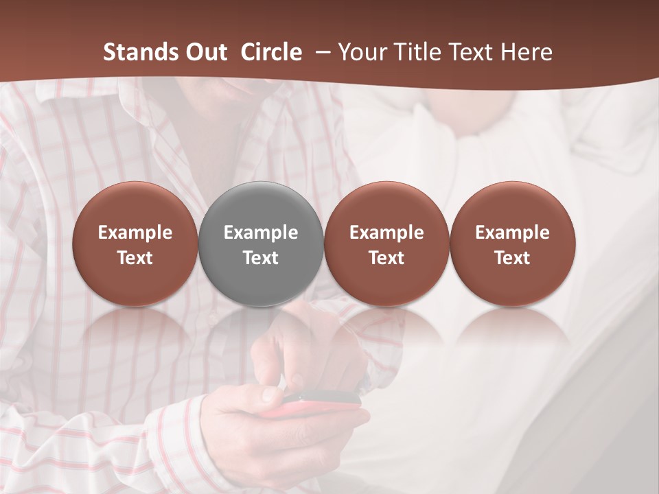 A Man Sitting On A Bed Looking At His Cell Phone PowerPoint Template