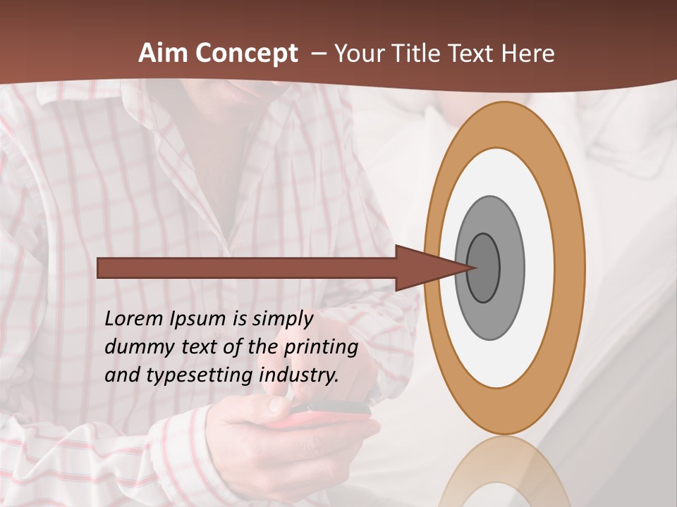 A Man Sitting On A Bed Looking At His Cell Phone PowerPoint Template