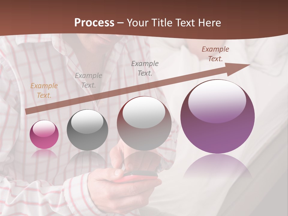A Man Sitting On A Bed Looking At His Cell Phone PowerPoint Template