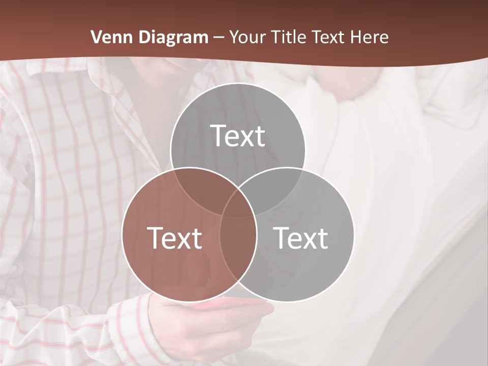 A Man Sitting On A Bed Looking At His Cell Phone PowerPoint Template