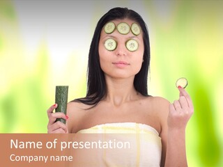 A Woman With Cucumbers On Her Eyes Holding A Piece Of Cucumber PowerPoint Template