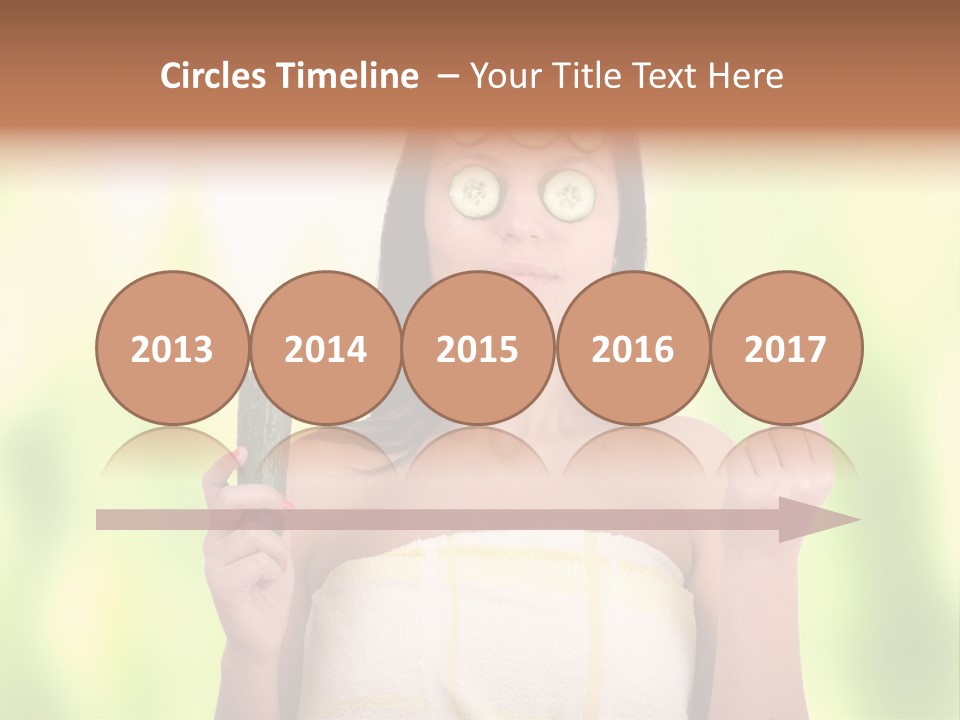 A Woman With Cucumbers On Her Eyes Holding A Piece Of Cucumber PowerPoint Template