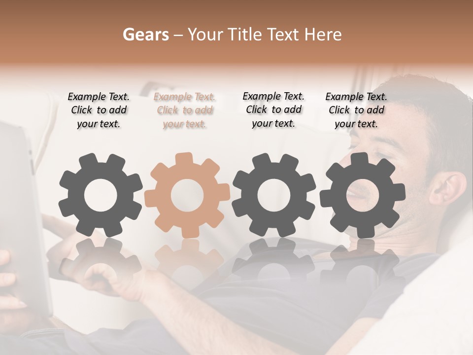 A Man Sitting On A Couch Looking At A Tablet PowerPoint Template