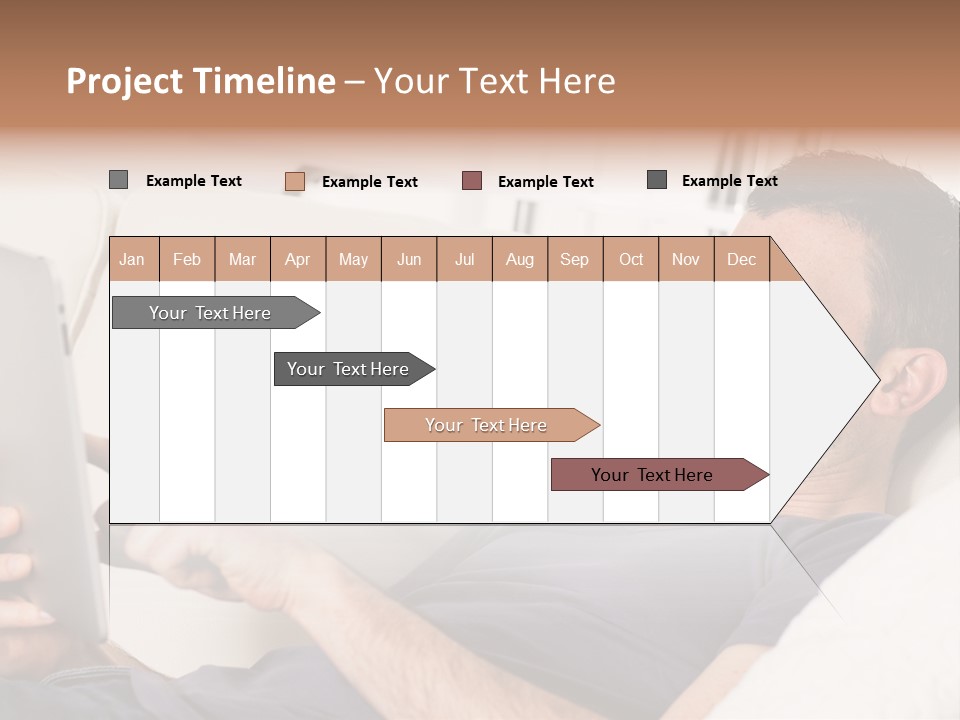 A Man Sitting On A Couch Looking At A Tablet PowerPoint Template