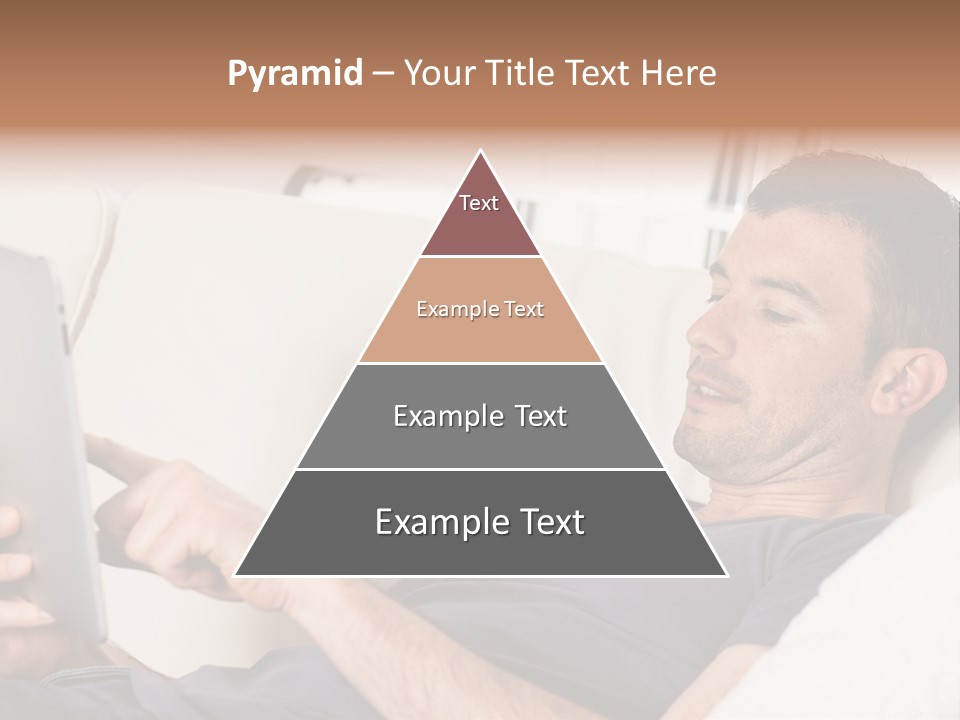 A Man Sitting On A Couch Looking At A Tablet PowerPoint Template