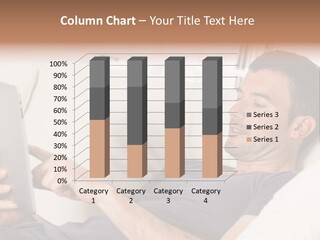 A Man Sitting On A Couch Looking At A Tablet PowerPoint Template