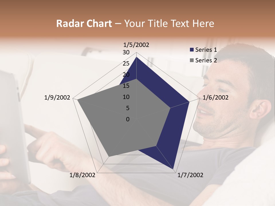 A Man Sitting On A Couch Looking At A Tablet PowerPoint Template